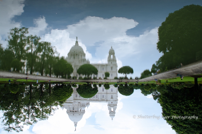 Victoria memorial reflected in the pond.